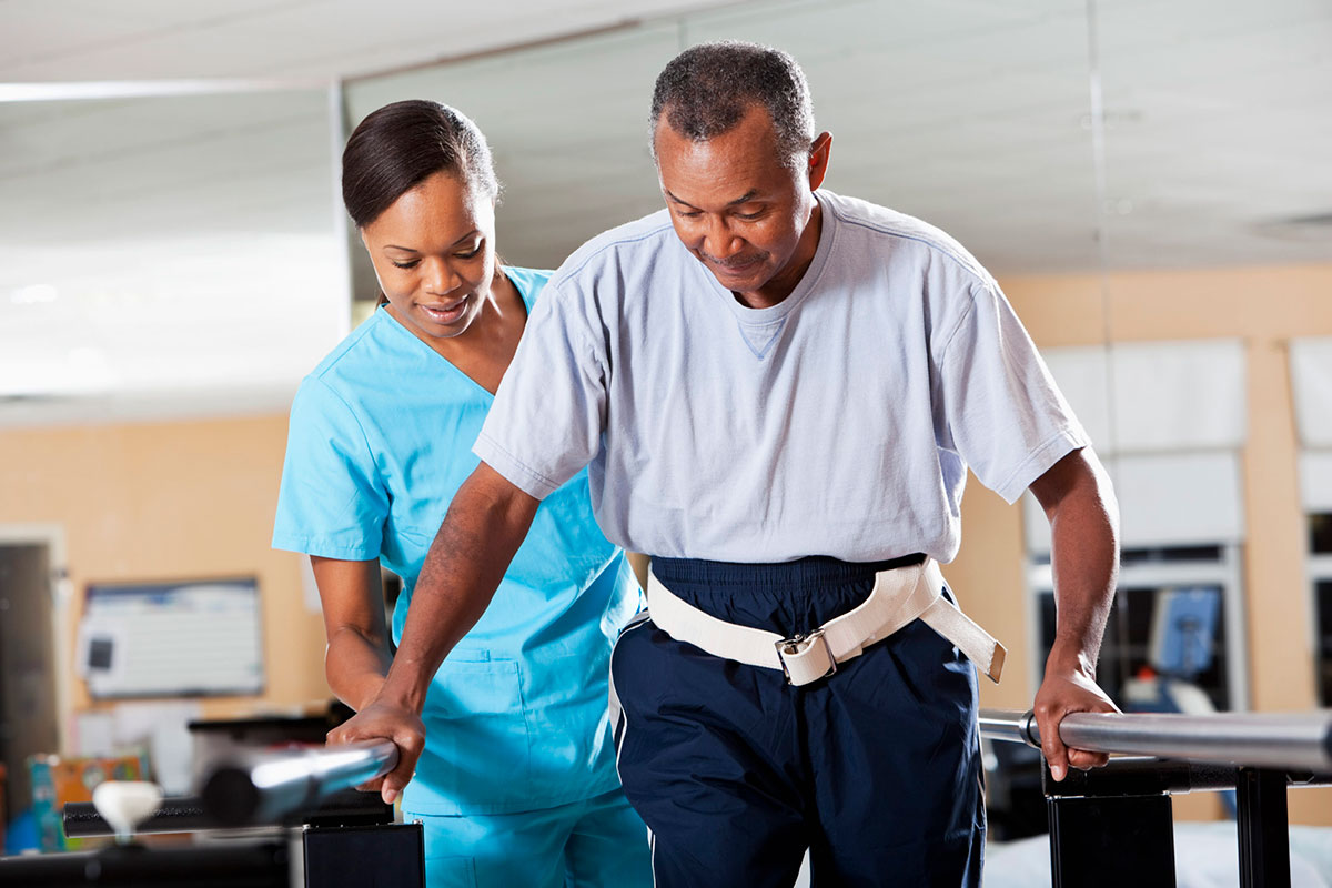 Nurse working with a patient in rehabilitation