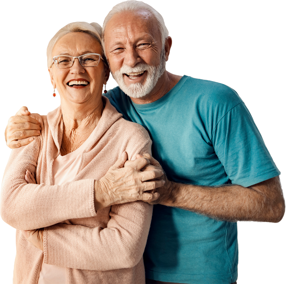 An older couple embraces, their faces beaming with joy, as they share a warm and affectionate hug.