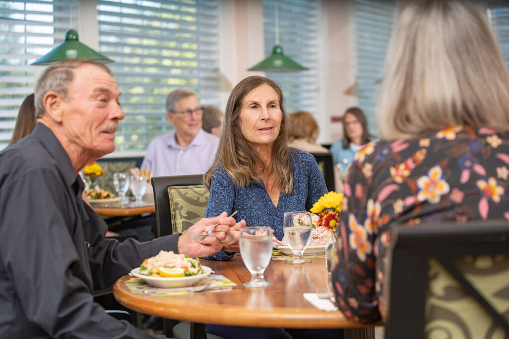 Residents enjoying a meal together