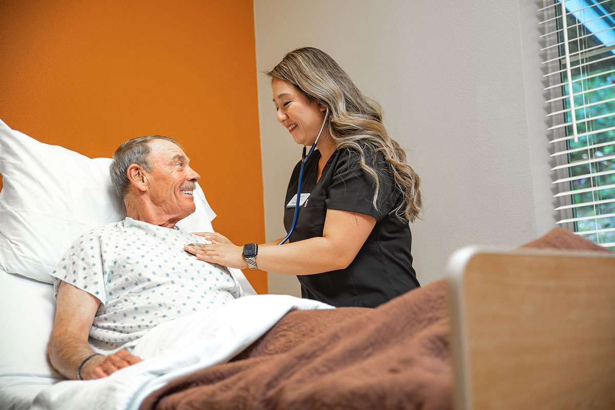 Nurse checking on a patient