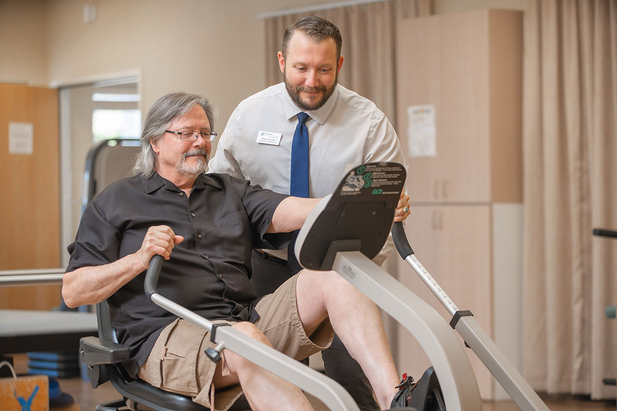 Northwoods Lodge staff member helping a patient with physical rehabilitation