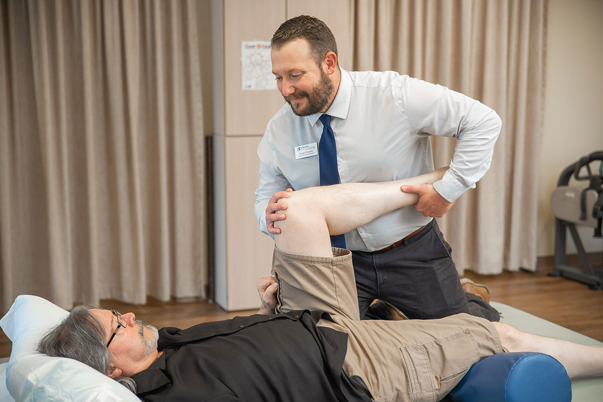 Northwoods Lodge staff member helping a patient with physical rehabilitation