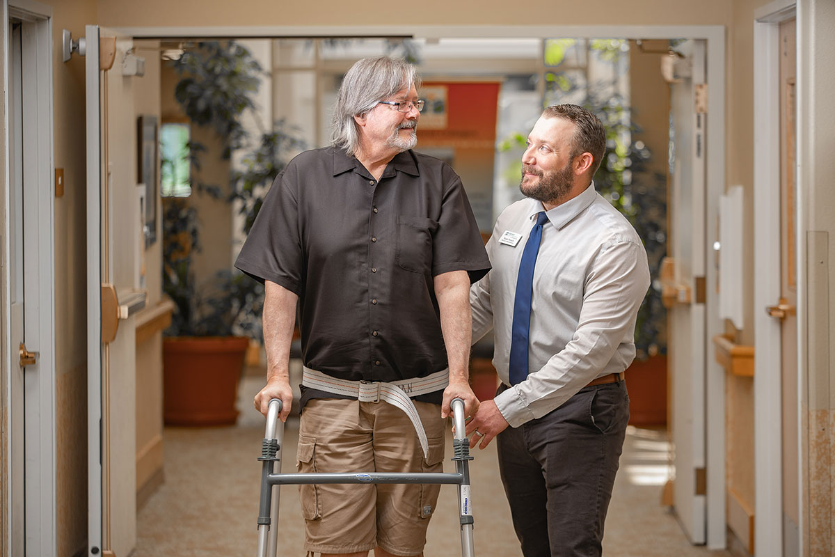 Northwoods Lodge staff member helping a patient with physical rehabilitation