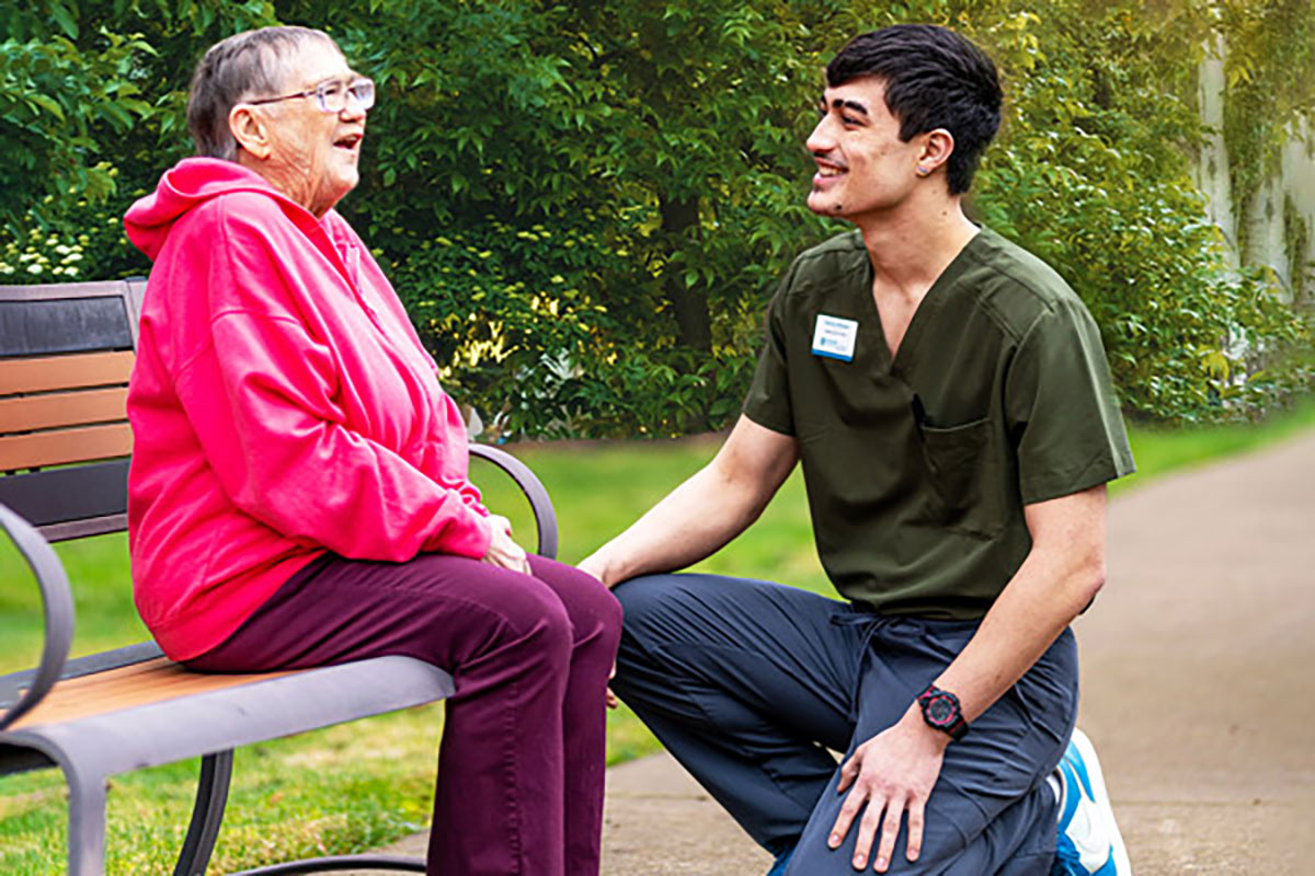 Resident outside with a staff member