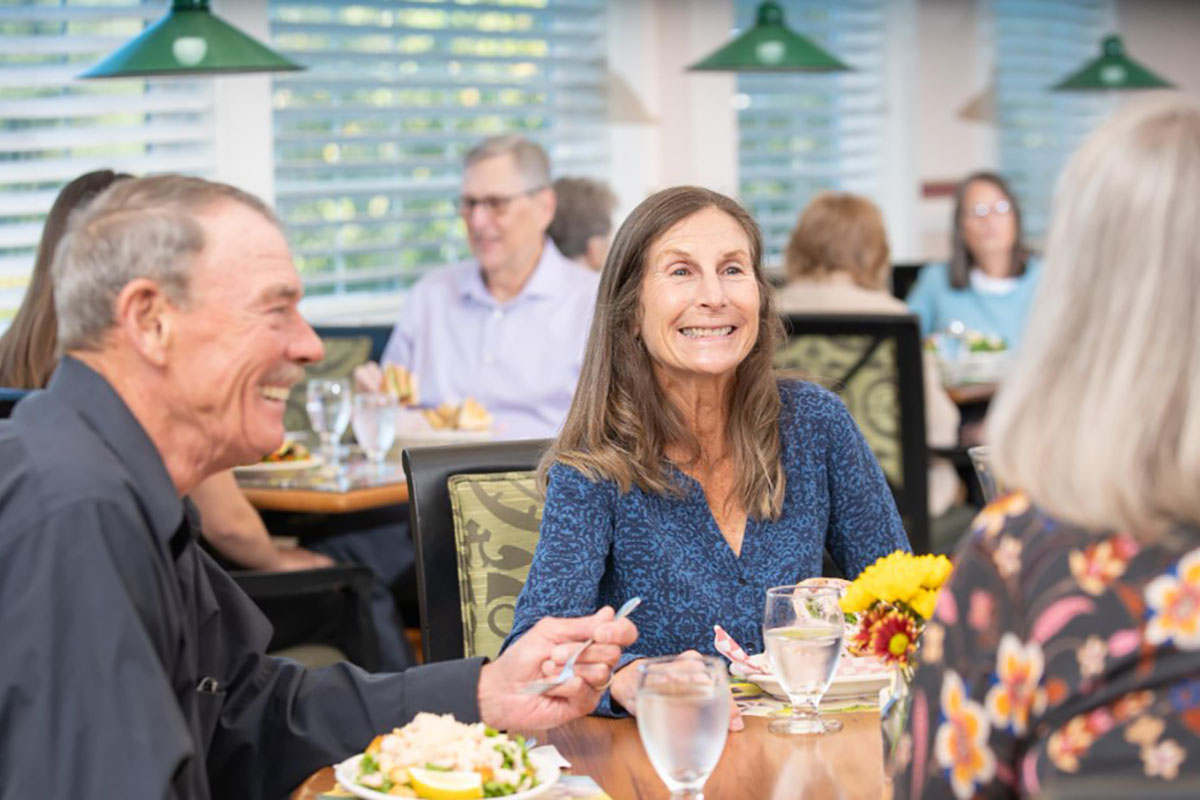 Residents enjoying a meal together