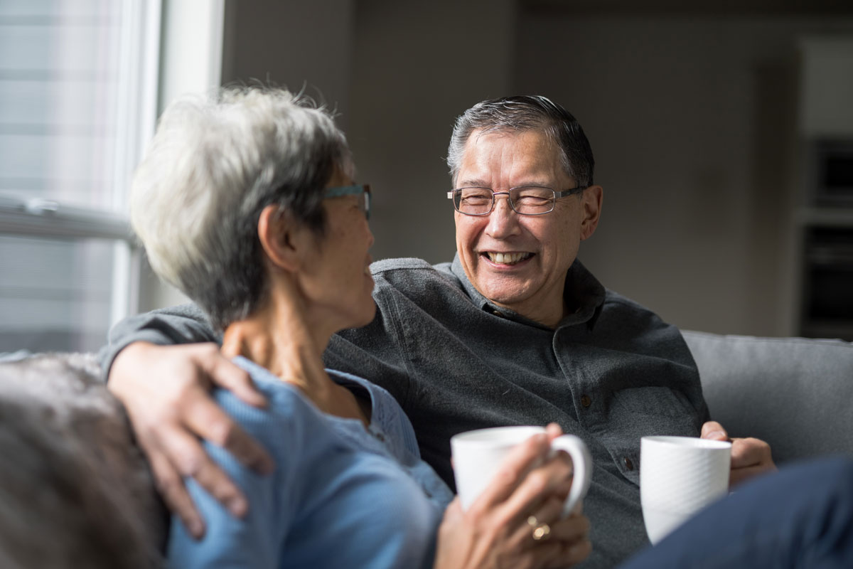 couple having coffee on couch