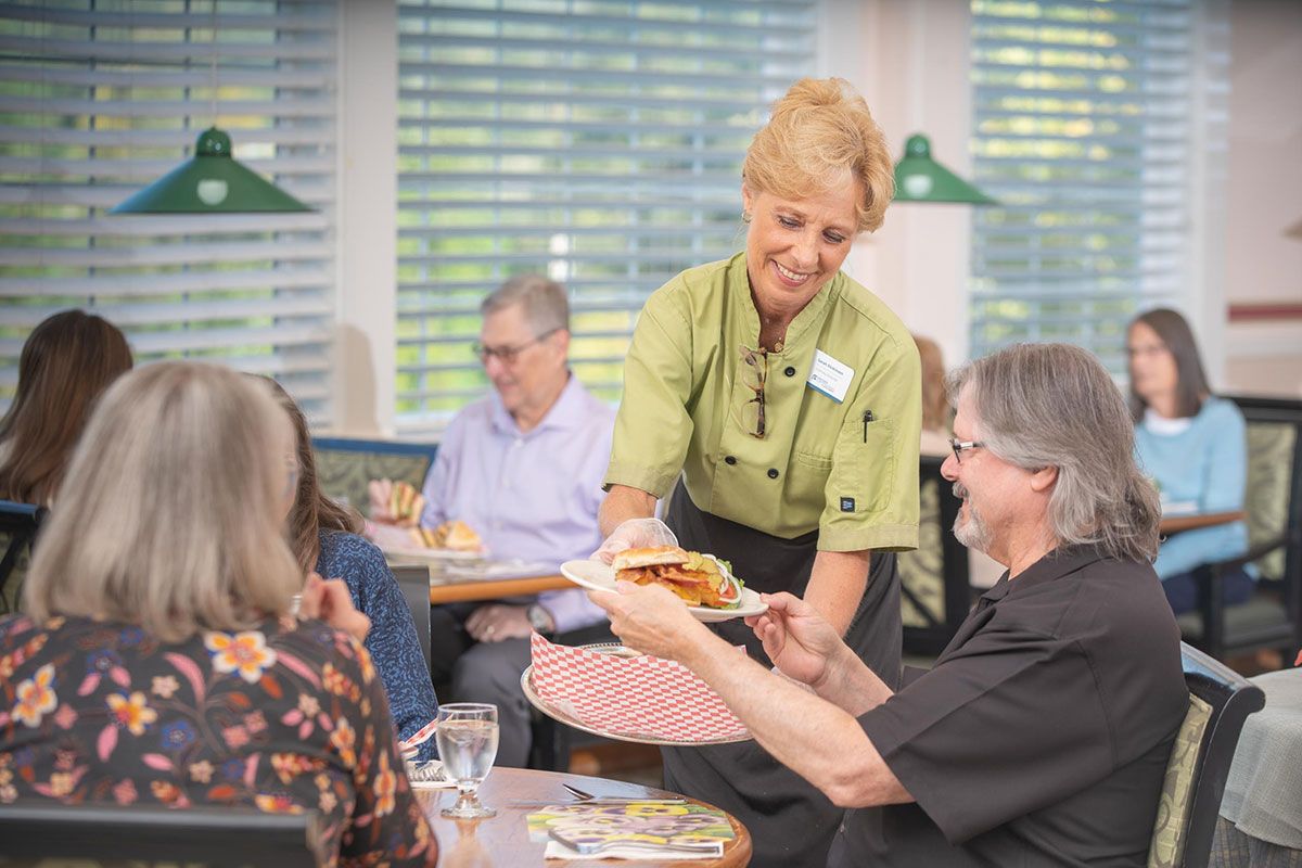 Residents enjoying a meal in the dining room