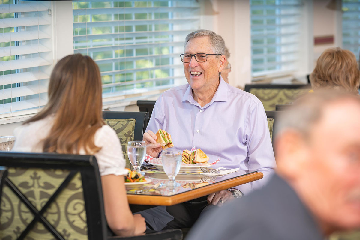 Residents enjoying a meal in the dining room