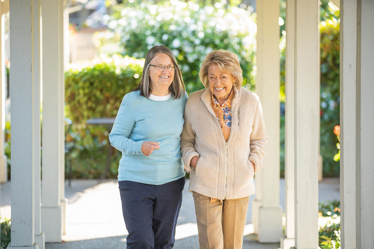 Mother and daughter walking outside