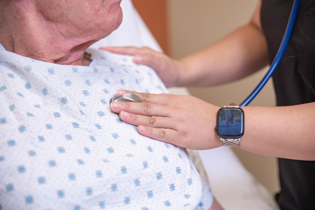 Nurse checking on a patient